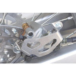 Works Connection Rear Brake Caliper Guard For Kawasaki KXF250 2004-2025, KX250XC 2020-2025, KXF450 2006-2025, KX450XC 2020-2023, Suzuki RMZ250 2004-2006